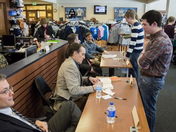 Hillsdale Faculty signing their books for students in the Hillsdale College bookstore.