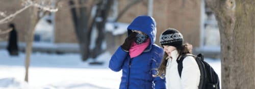 Students walking on campus in snow