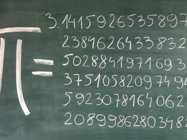 Hand-written Pi numbers on green chalkboard