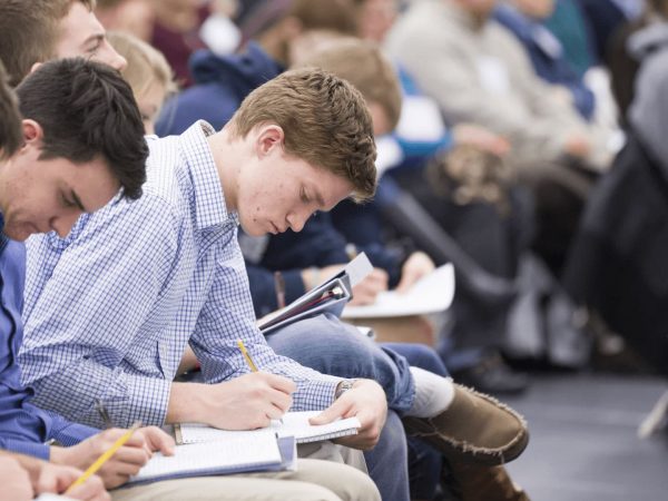 CCA attendees taking notes during a lecture.