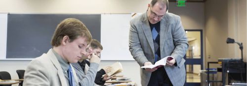 Faculty teaching German in a classroom.