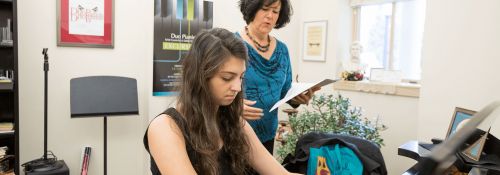 Student playing piano