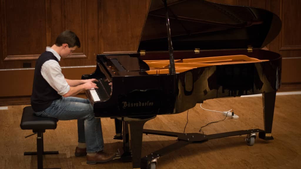 Taylor Flowers playing the piano.