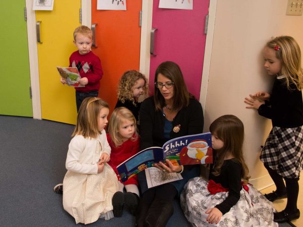 Teacher reading to Mary Randall Preschool students