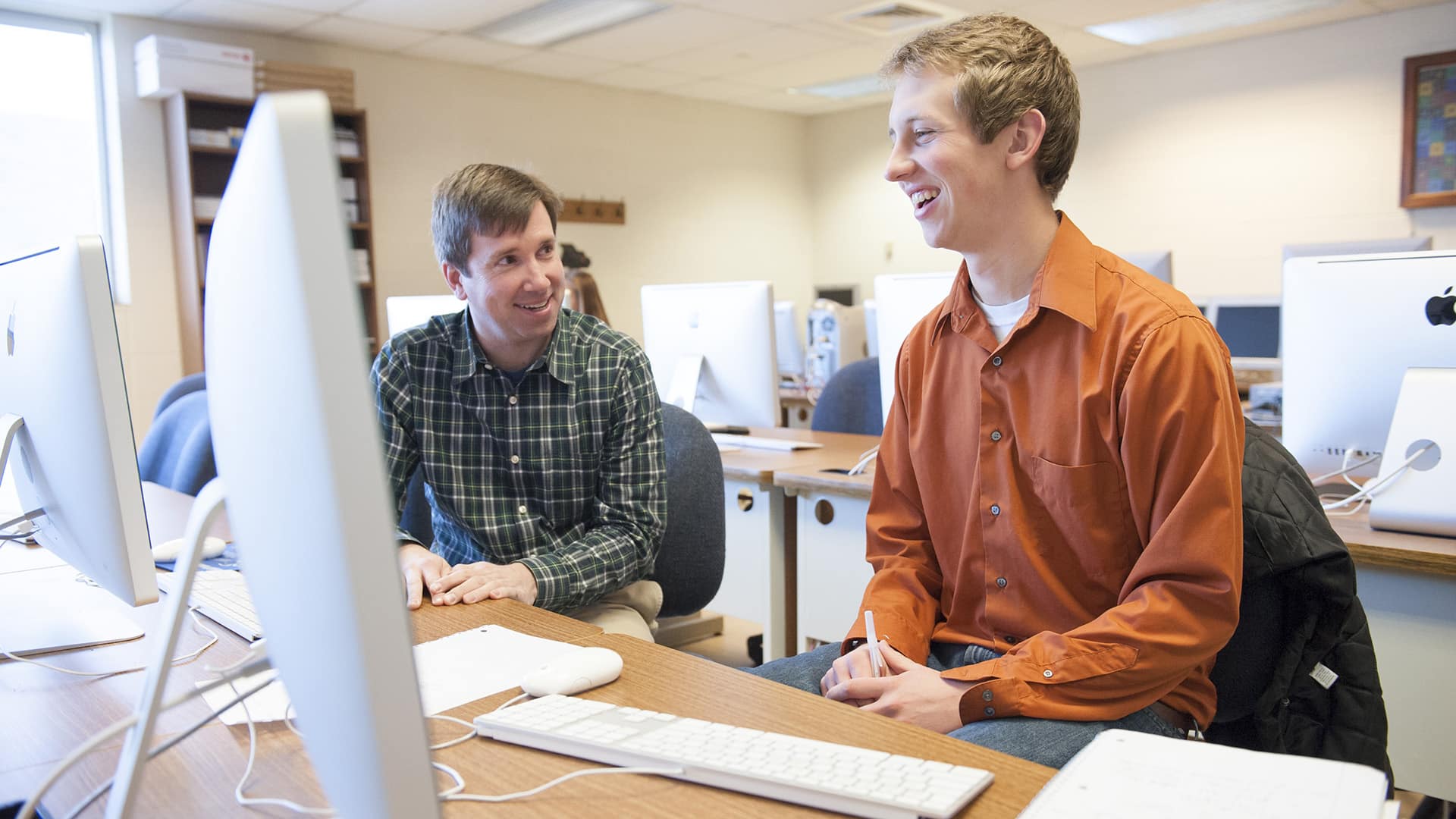Student and teacher in the Eaton Computer Lab.