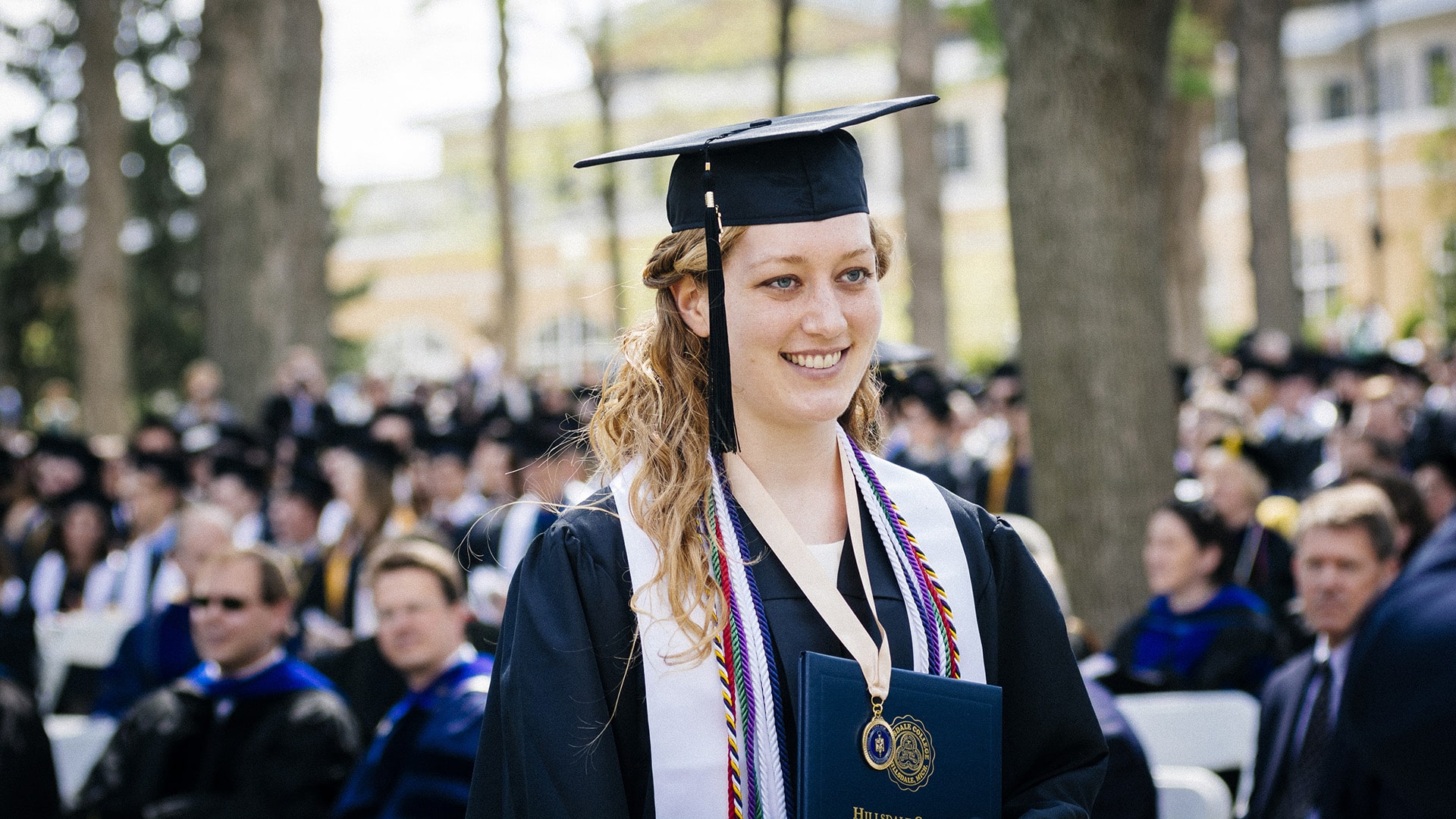 Ellen Roundey in cap and gown during graduation.