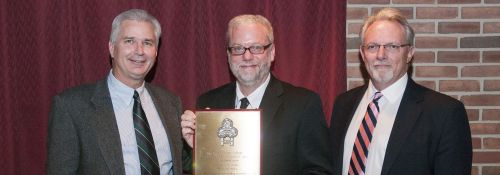 Greg Wolfe presented with Alumni Award