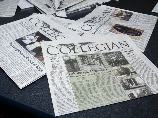 Several Collegian newspapers on a table.