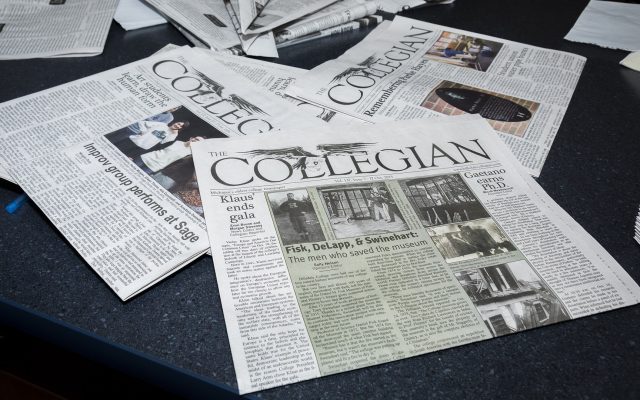 Several Collegian newspapers on a table.