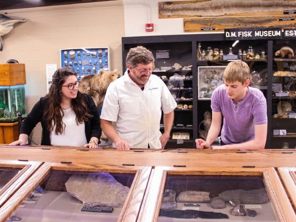 Professor with students at Fisk Museum