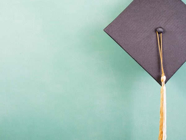 grad cap with green background