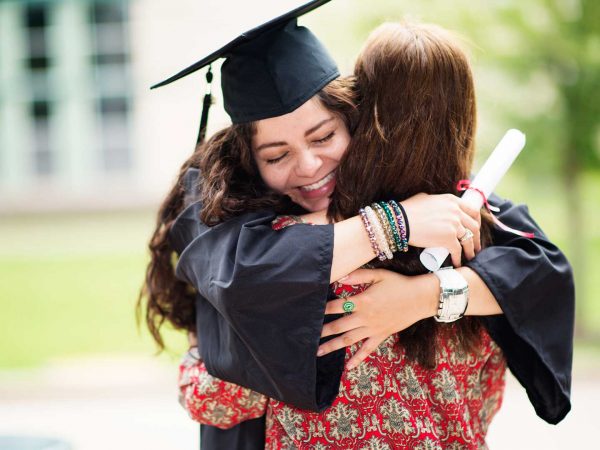 Graduation Girl Hugging Mom
