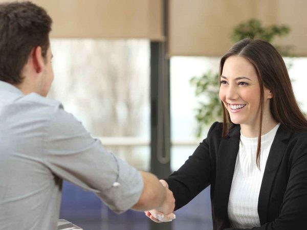 man and woman job handshake