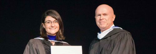 Phil Kilgore awarding the Henry Salvatori Prize for Excellence in Teaching to Dr. Kathleen O’Toole.