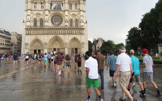 Front exterior of Notre Dame Cathedral in Paris, France.