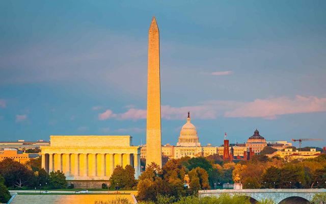 Wide shot of Washington D.C. viewing the Lincoln Memorial, the Washington Monument, the Capitol building, and Smithsonian castle.