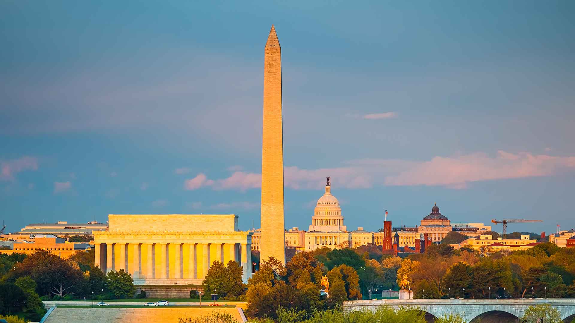 Wide shot of Washington D.C. viewing the Lincoln Memorial, the Washington Monument, the Capitol building, and Smithsonian castle.