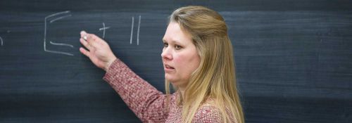 Courtney E. Meyet at chalkboard Nov. 2017