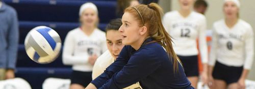 Student competing in a volleyball game.