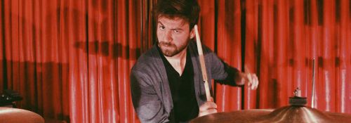 Dean Sinclair playing on a drumset.