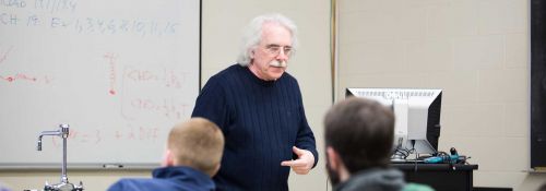 Dr. Hayes teaches a physics class.