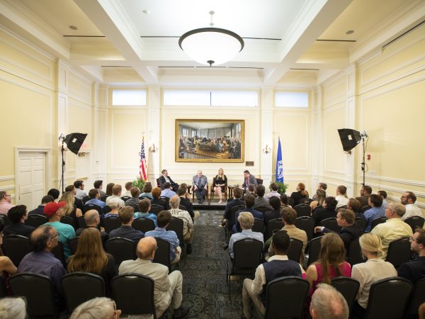 Audience gathered listening to Paul A. Cantor, Beverly Hallberg, and James Taranto.