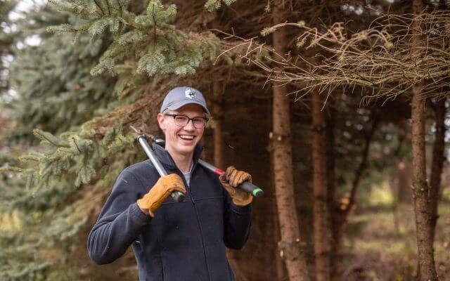 A volunteer with trimming shears.