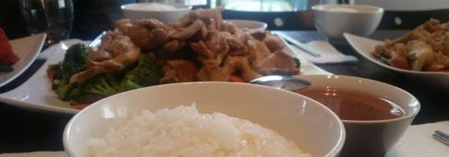 Bowls of rice, stir-fry, and soup.