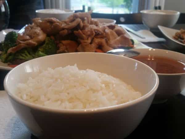 Bowls of rice, stir-fry, and soup.