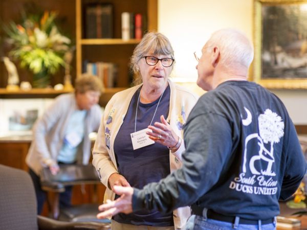Lifelong Learning Seminar attendees conversing.