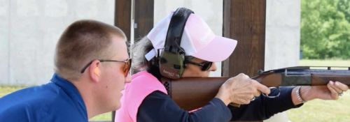 Instructor assisting Ladies for Liberty attendee on clay shooting.