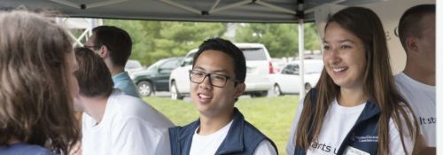Students discussing on-campus employment at a booth.