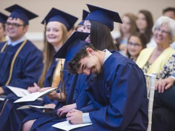 Students laughing at commencement
