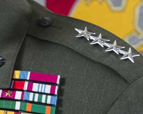 Closeup of a U.S. Marine Lt. Gen. uniform's stars and medals.