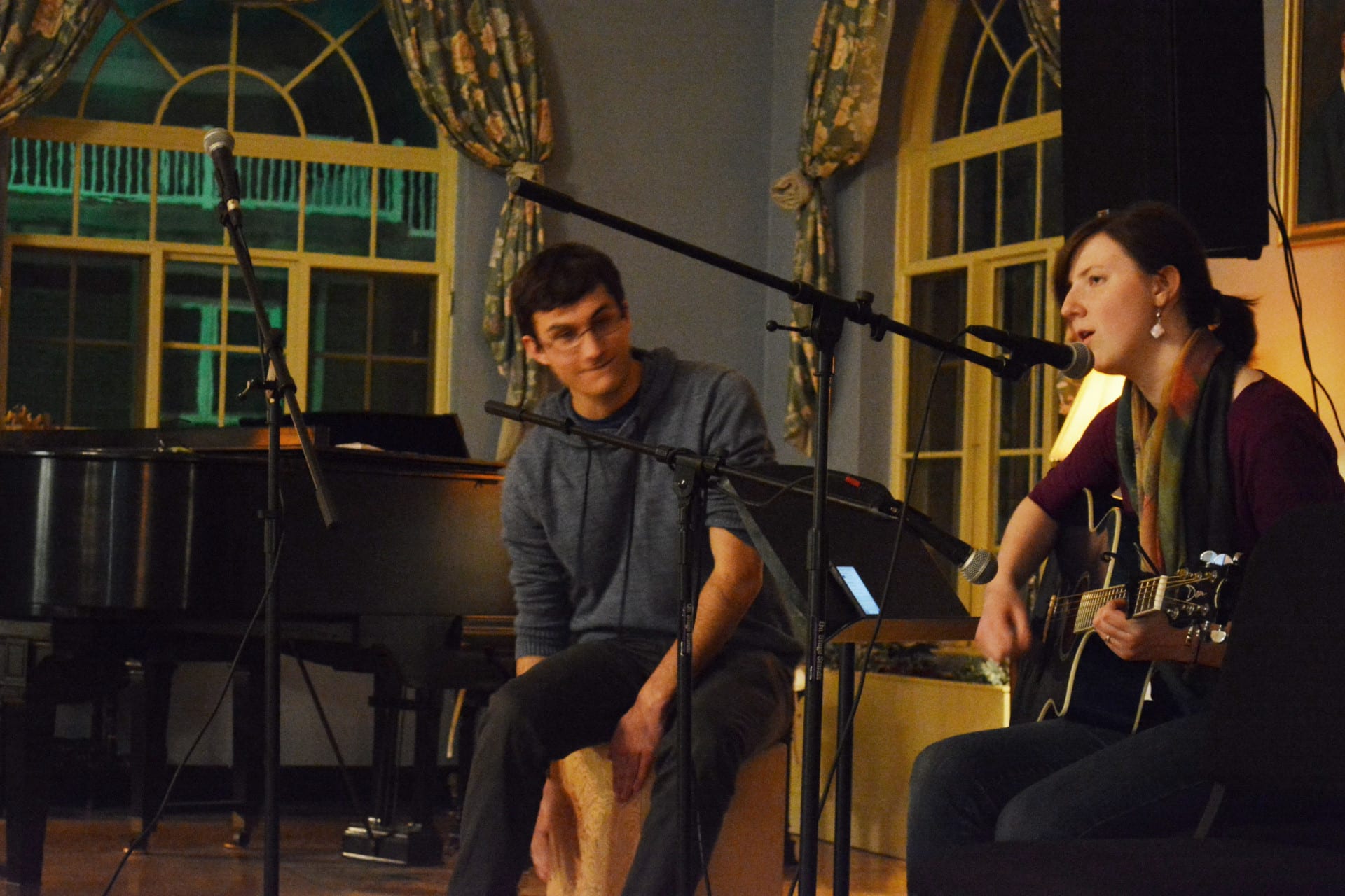 A small group playing at a coffee house style concert.