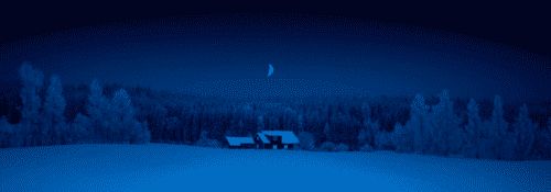 Distant country house surrounded by woods and snow.