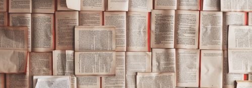 Books pinned to wall