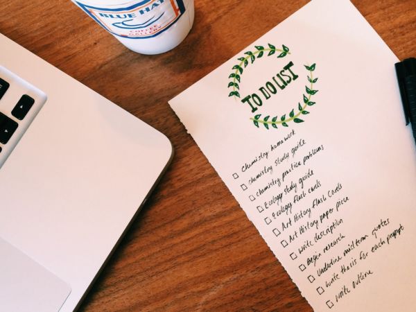 Laptop with coffee and notepad