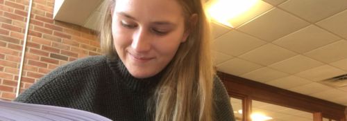 Student Callie Stoub reading a book