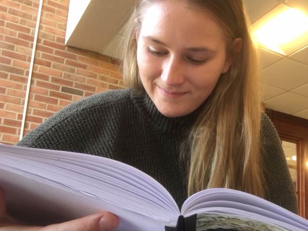 Student Callie Stoub reading a book