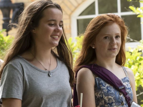 Two female students walking