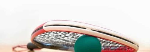 racquetball and racquetball racquet on a racquetball court