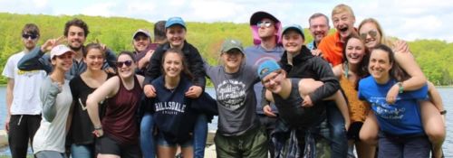 Group of students and professors standing outdoors at biological center
