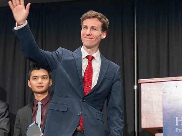 Well-dressed Hillsdale students on stage after presenting their oratories