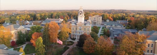 an aerial view of campus with orange and gold foliage