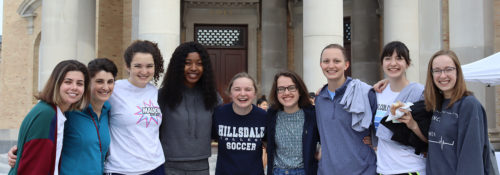 Hillsdale students posing while participating in the Day of Service
