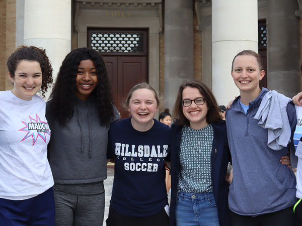 Hillsdale students posing while participating in the Day of Service