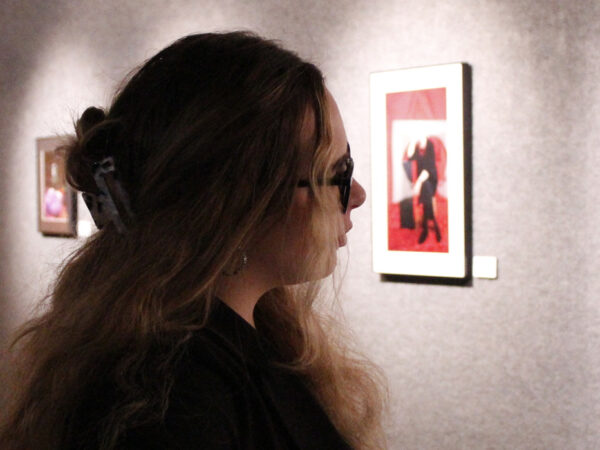A student looking at a painting