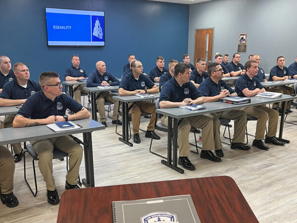 Hillsdale College Law Enforcement Constitution Course handbook on a speaker's podium