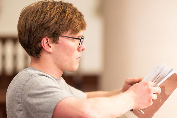 A retreat participant reads from the Bible.